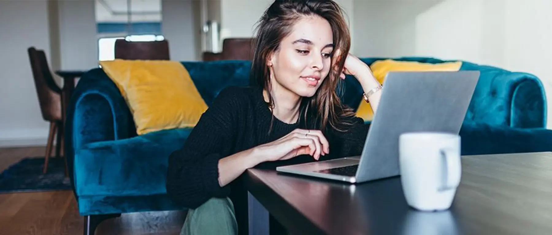 woman looking at her laptop