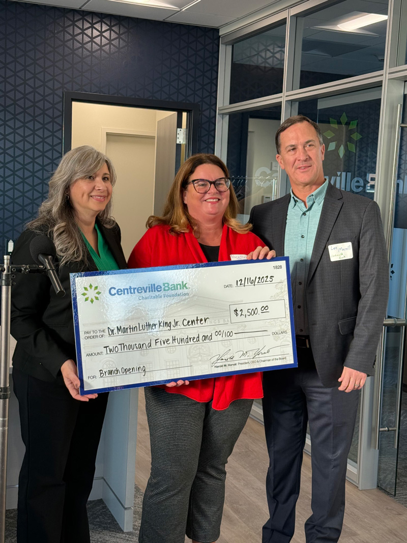 Representatives holding a $2,500 ceremonial check for the Dr. Martin Luther King Jr. Center from Centreville Bank.