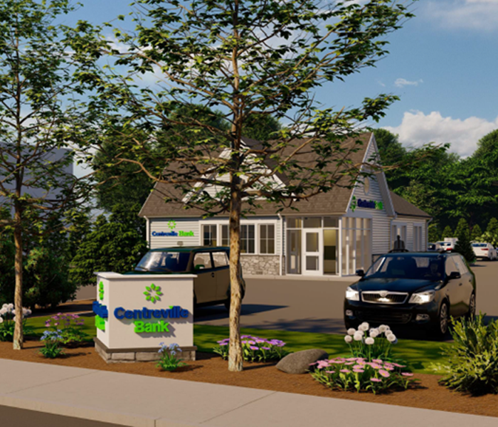 Architectural rendering of a new Centreville Bank building with a sign, landscaping, and cars parked in front.
