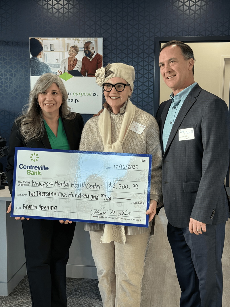Representatives holding a $2,500 ceremonial check for Newport Mental Health Center.