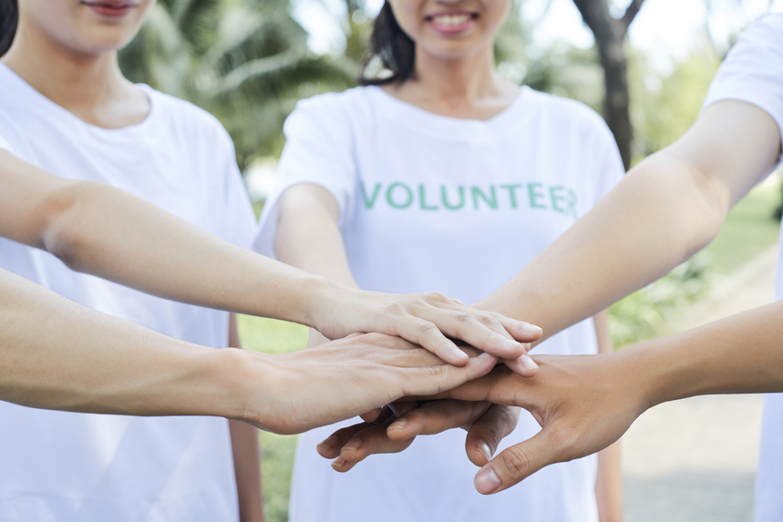 Student volunteers in a huddle