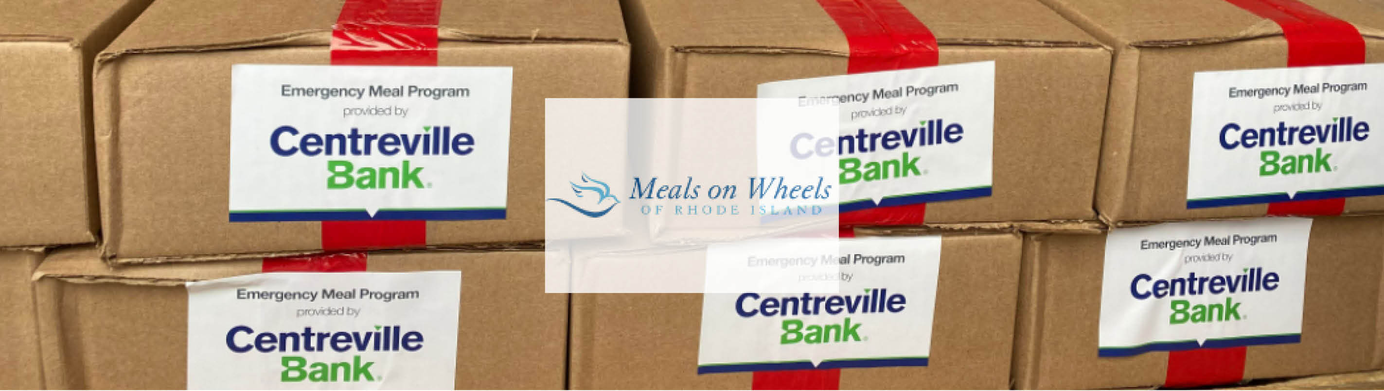 Boxes labelled Emergency Meal Program provided by Centreville Bank, with the Meals on Wheels logo